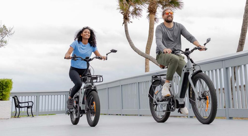 Imagine eBikes two riders on beach